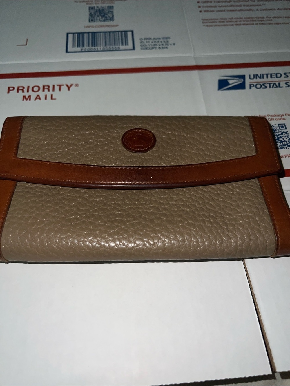 Dooney & Bourke Taupe Pebbled Leather Wallet with Brown Trim